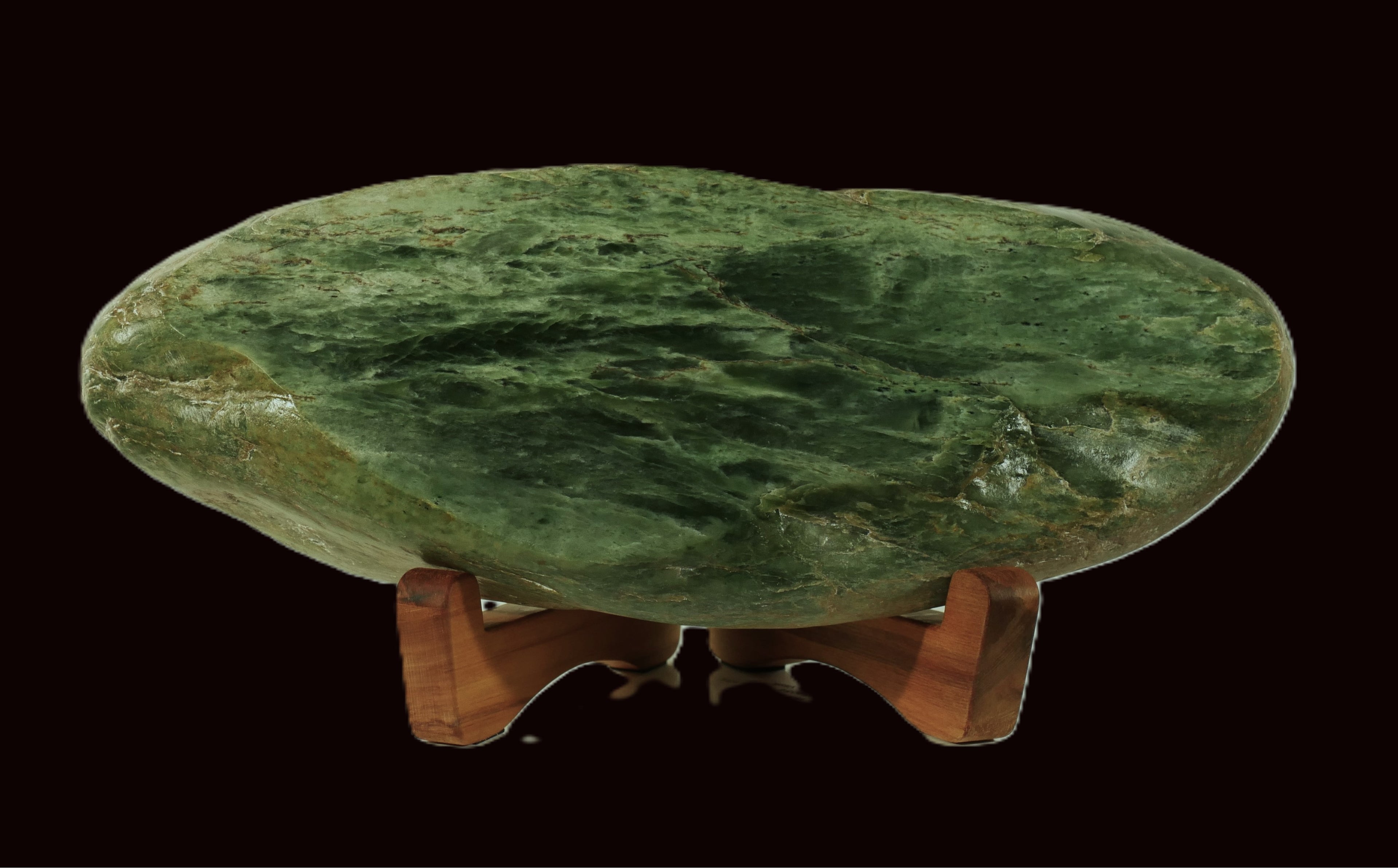 Freeform polished jade mounted on a rimu base (AU0020)