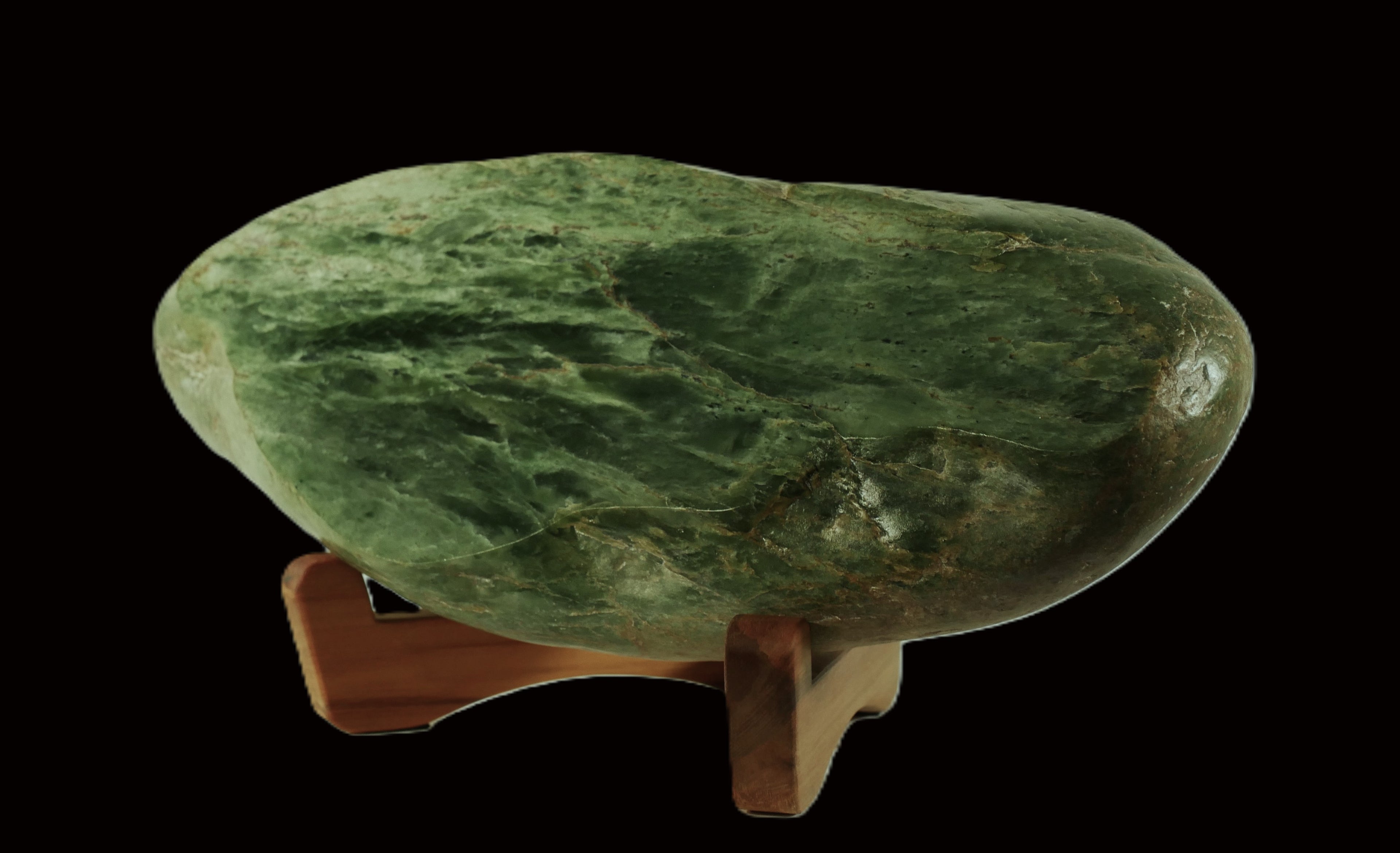 Freeform polished jade mounted on a rimu base (AU0020)