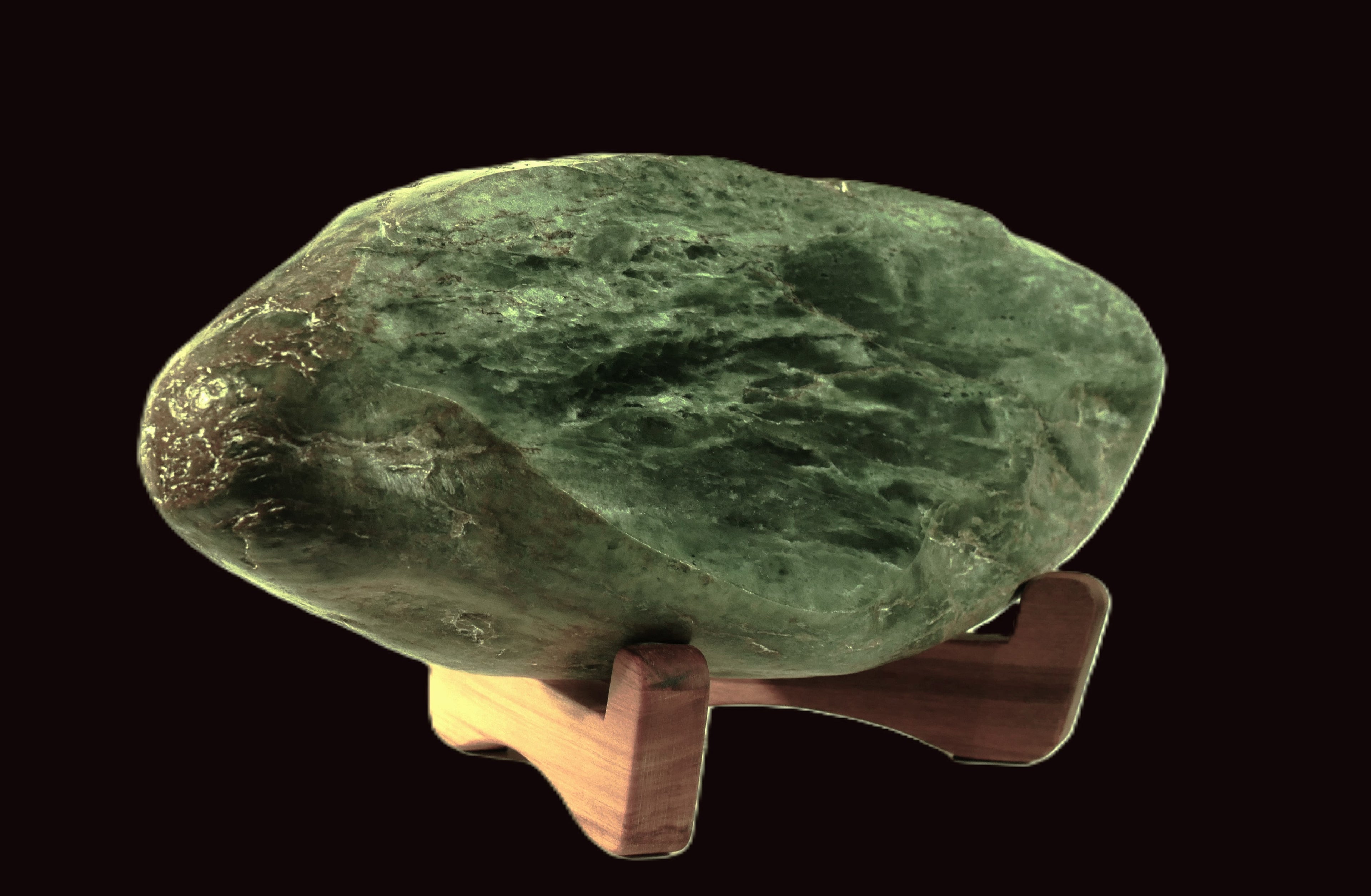 Freeform polished jade mounted on a rimu base (AU0020)