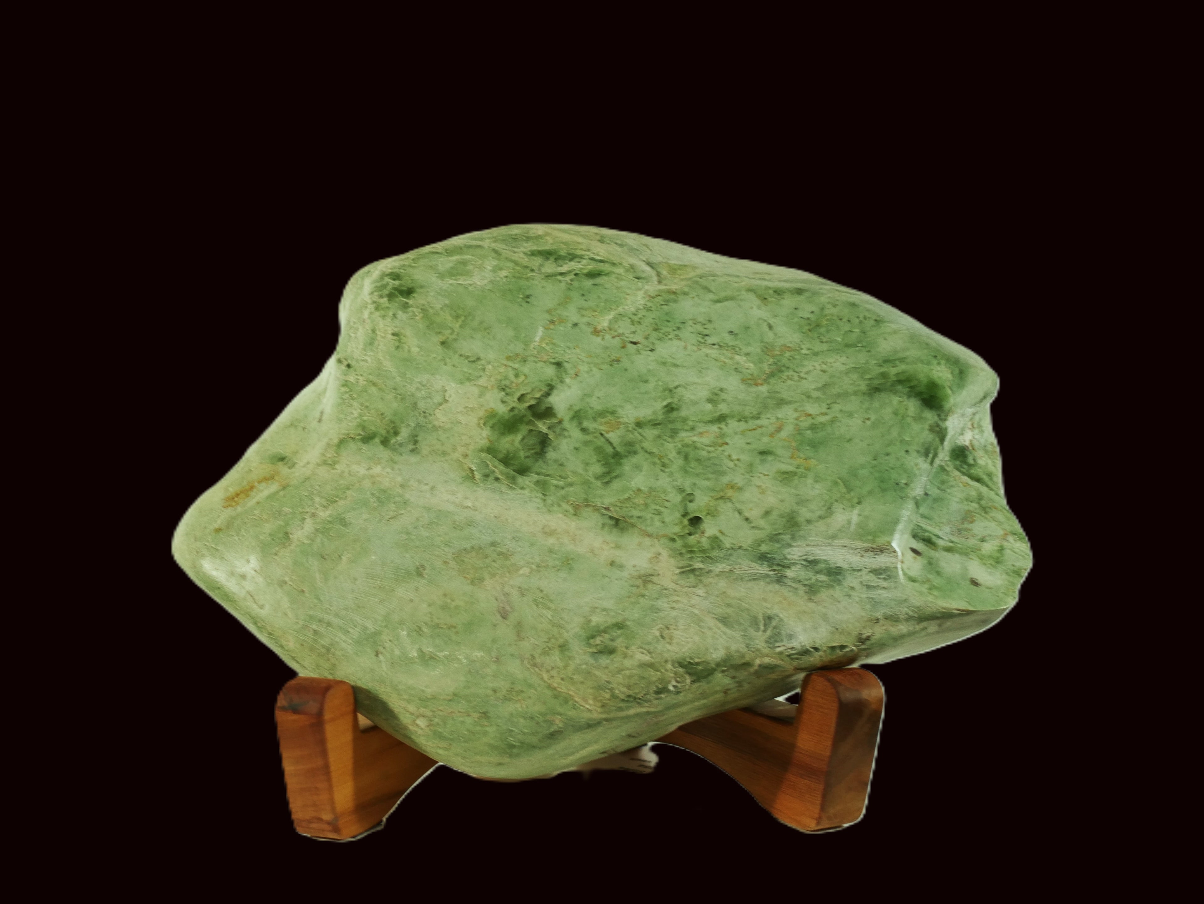 Freeform jade sculpture mounted on a rimu base (IN0014)