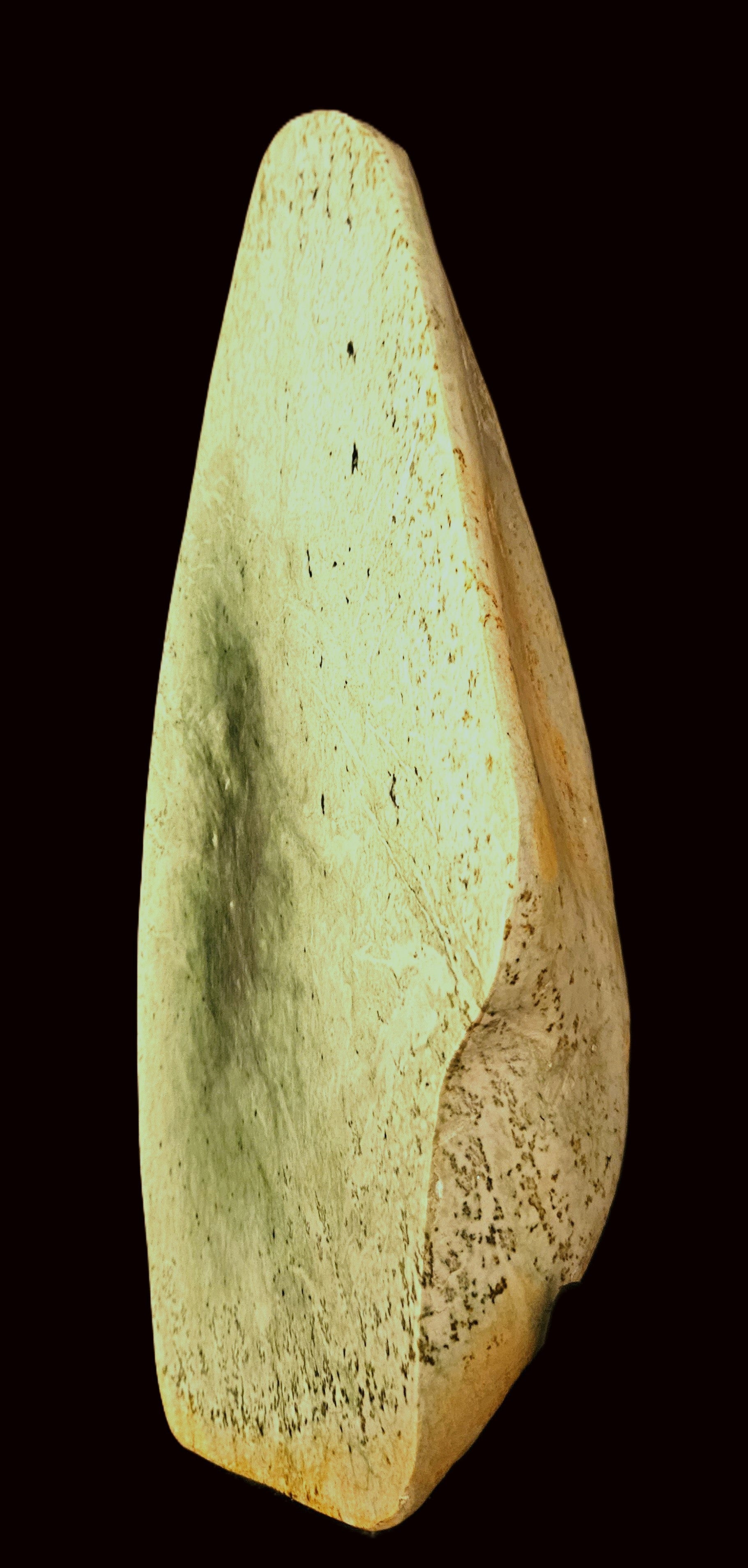 Freeform jade sculpture mounted on hardwood plinth