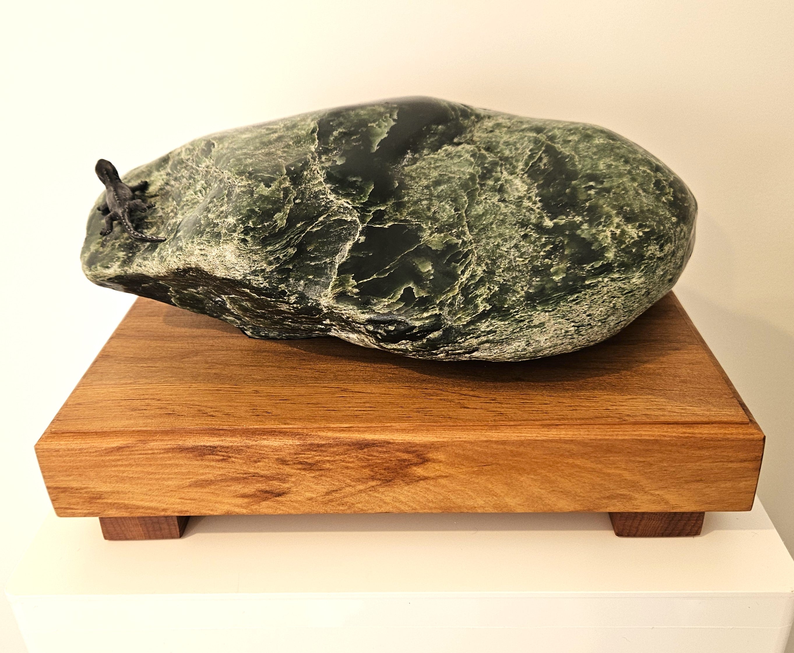 Freeform jade sculpture mounted on a rimu base (KW0007)